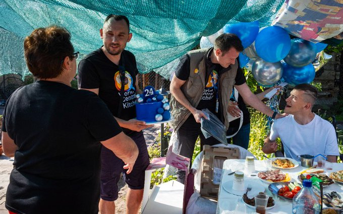From ashes to hope in Bucha! This week, the WCK team joined Lyuda, Bogdan & their family and friends to share a meal and celebrate Bogdan’s 24th birthday. His laptop destroyed with their home, @natemook gave Bogdan a new one & we’re helping provide a new walker! #ChefsForUkraine