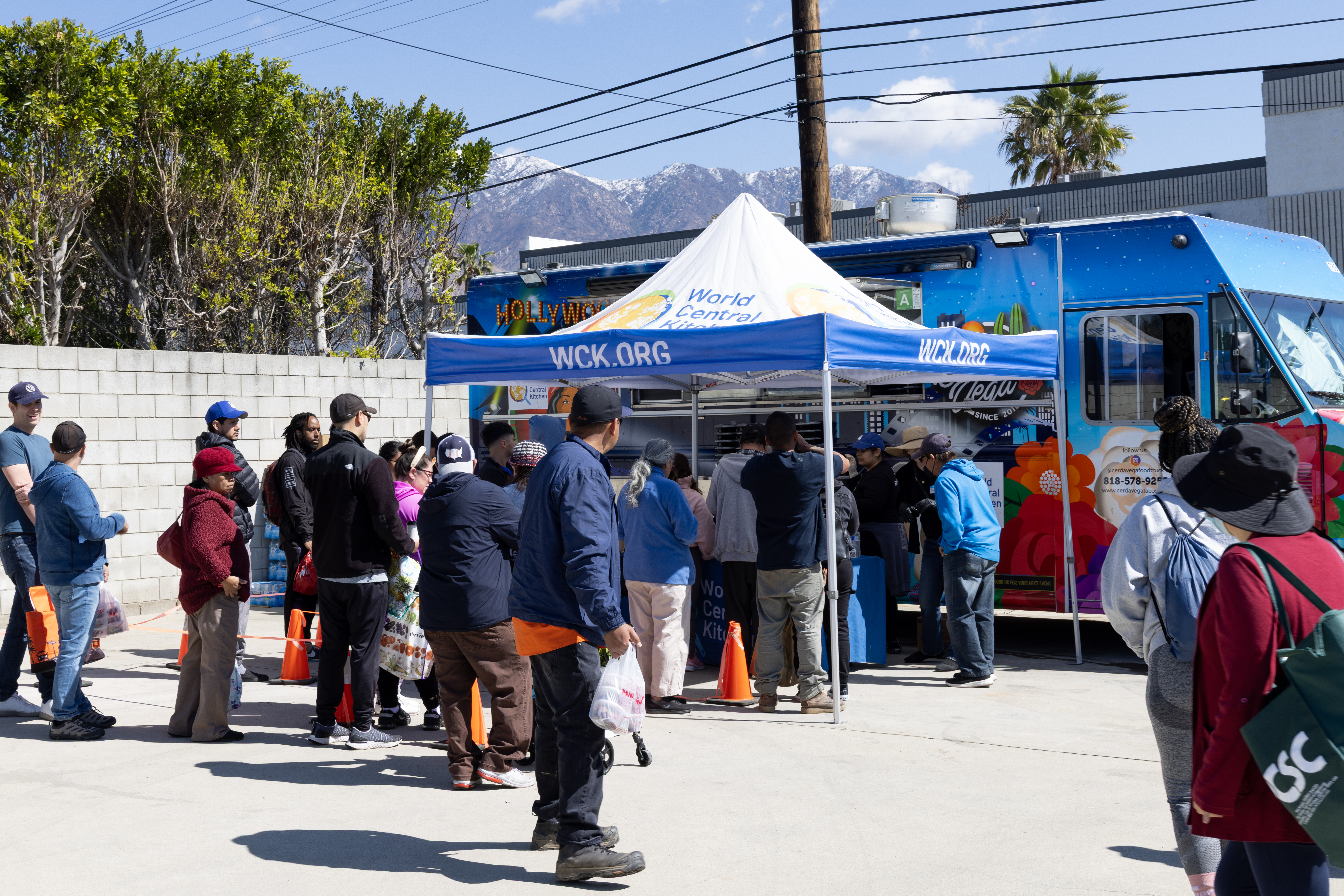 People lined up at a WCK meal distribution site in Atadena after the 2024 LA wildfires.