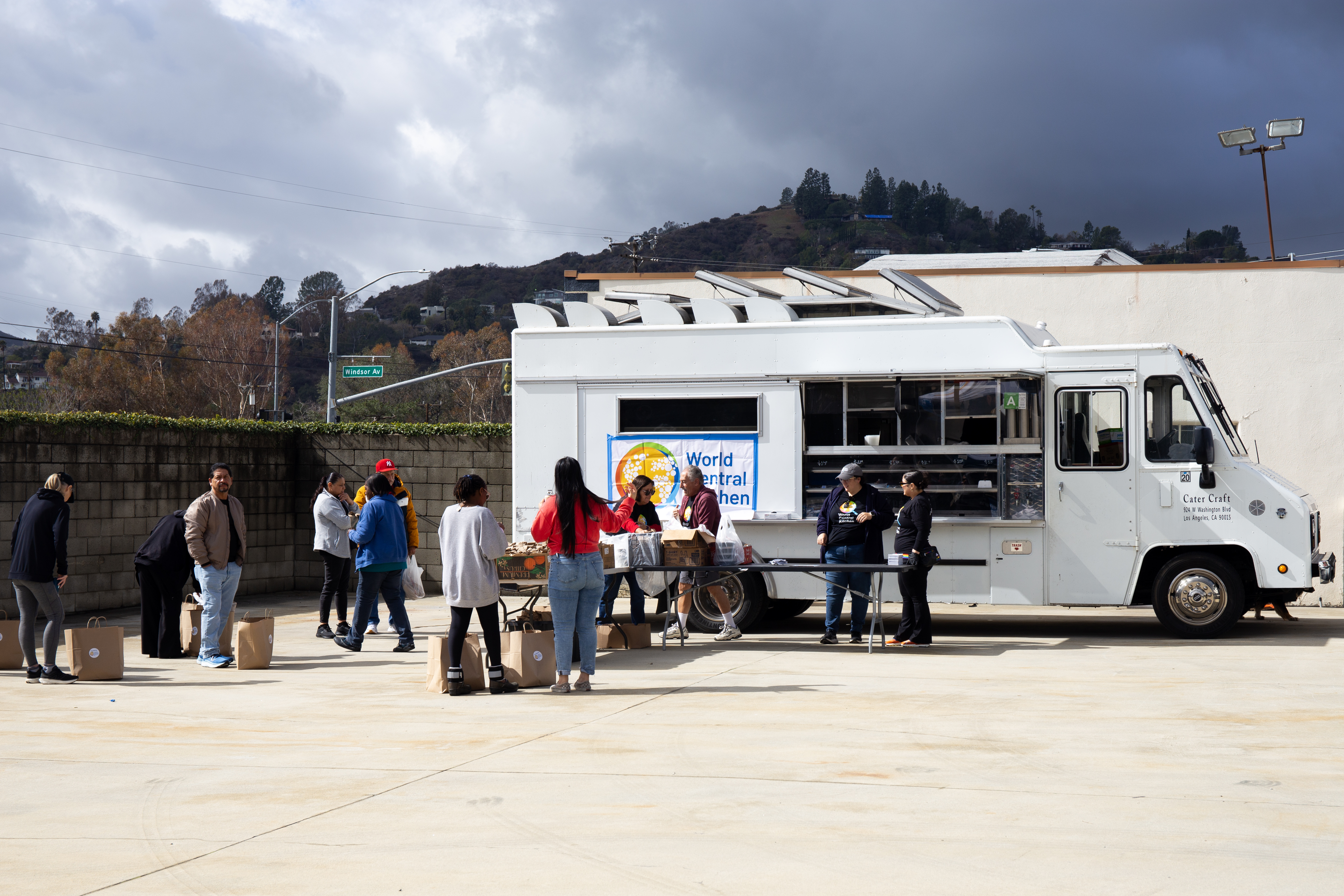 People lined up at a WCK meal distribution site in Atadena after the 2024 LA wildfires.